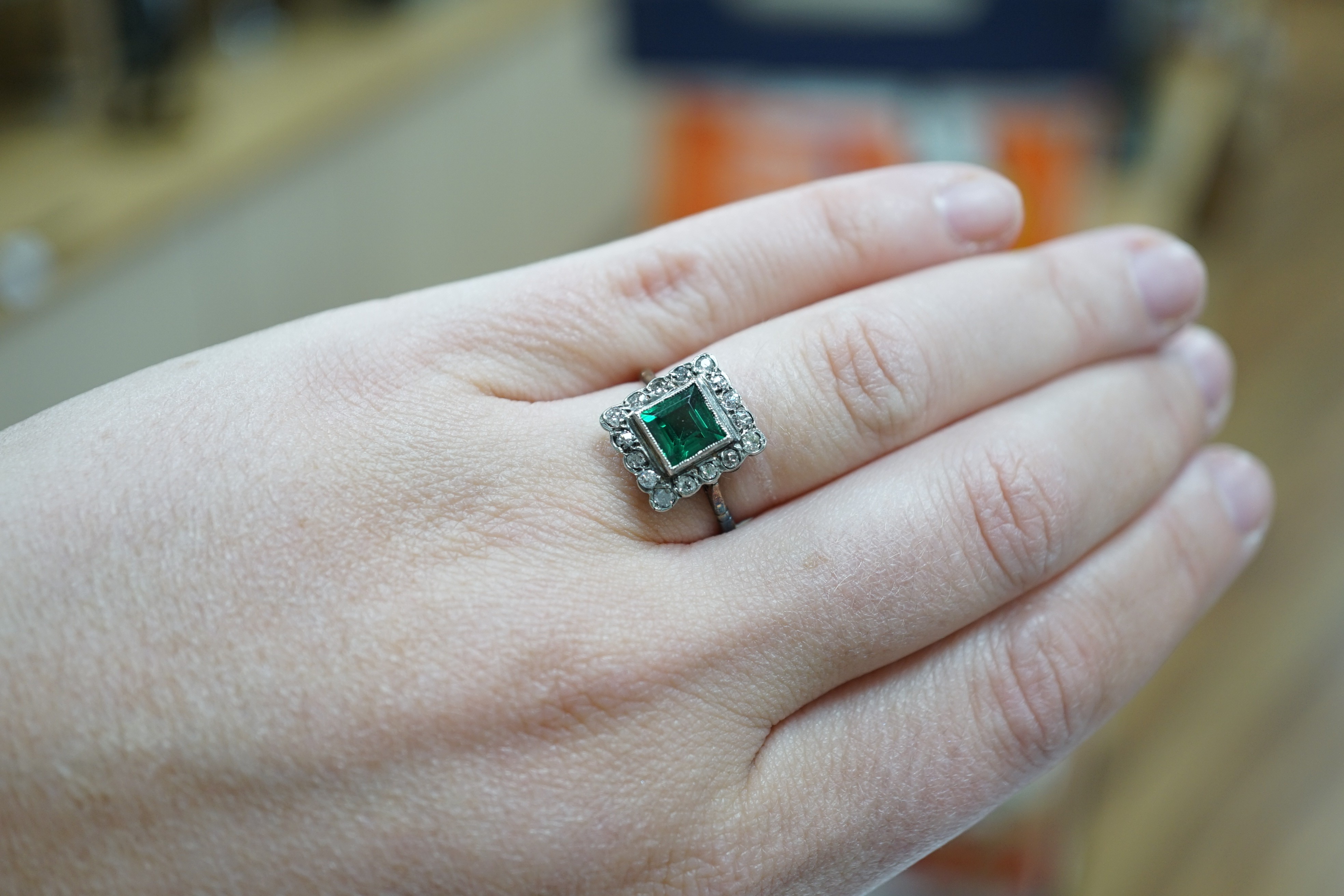 An 18ct gold, green paste? and diamond set square cluster ring, size L, gross weight 2.2 grams.